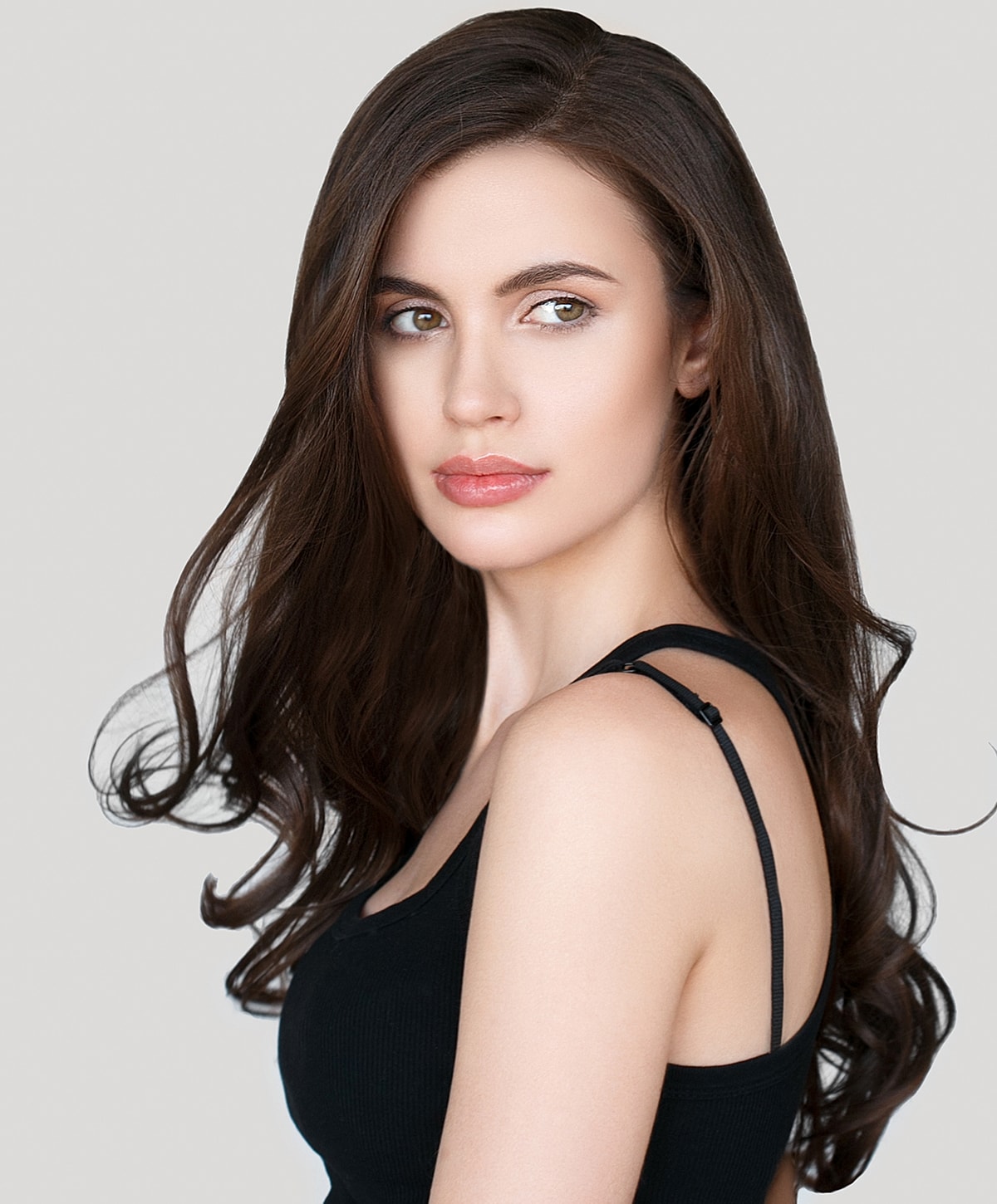 Portrait of a woman with long, wavy hair.