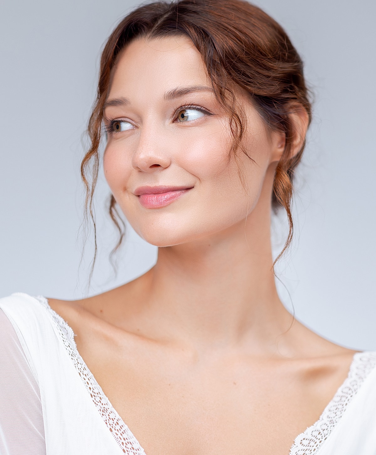 Model posing against a textured background.