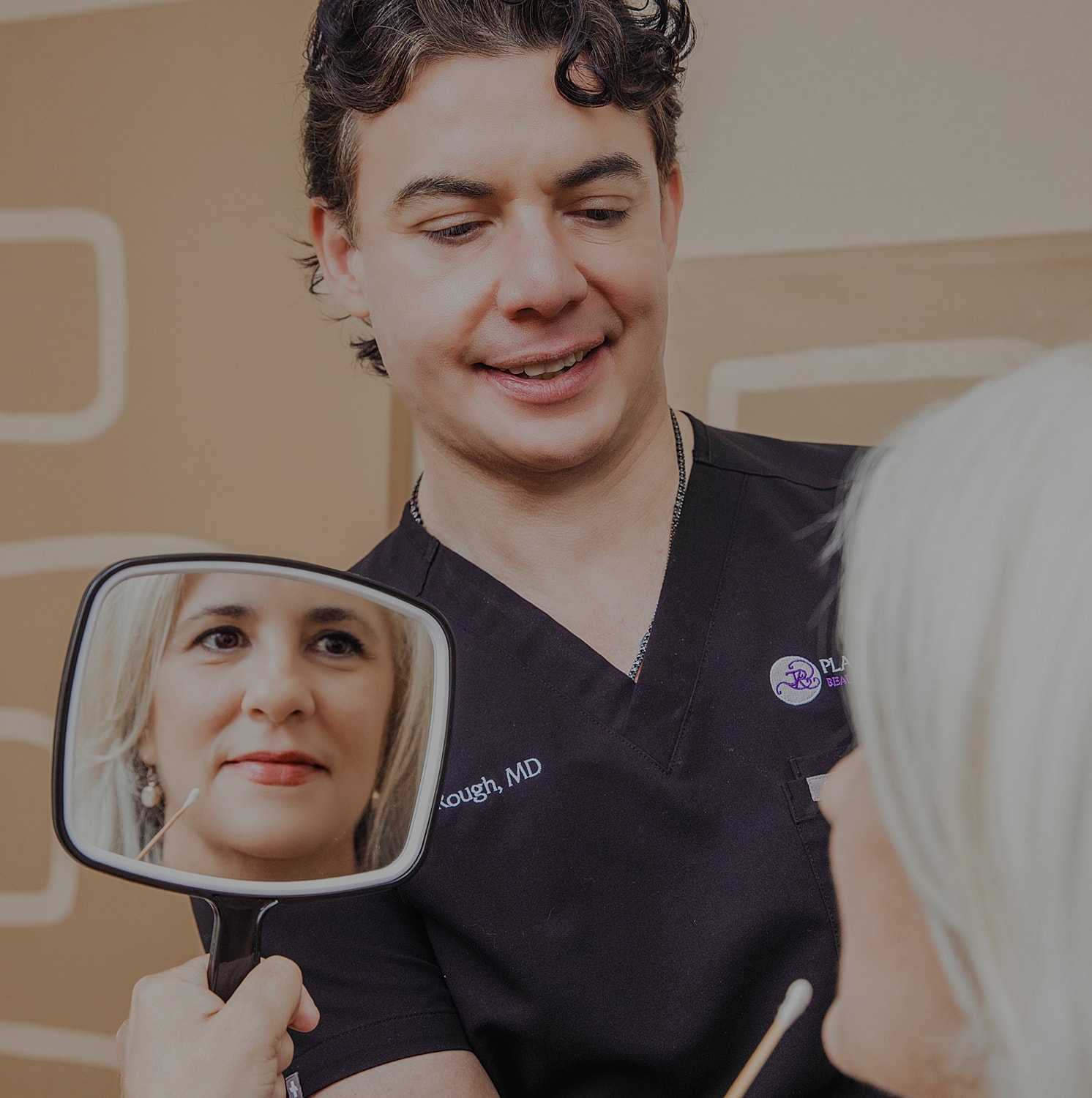 Doctor consulting with patient using a mirror.